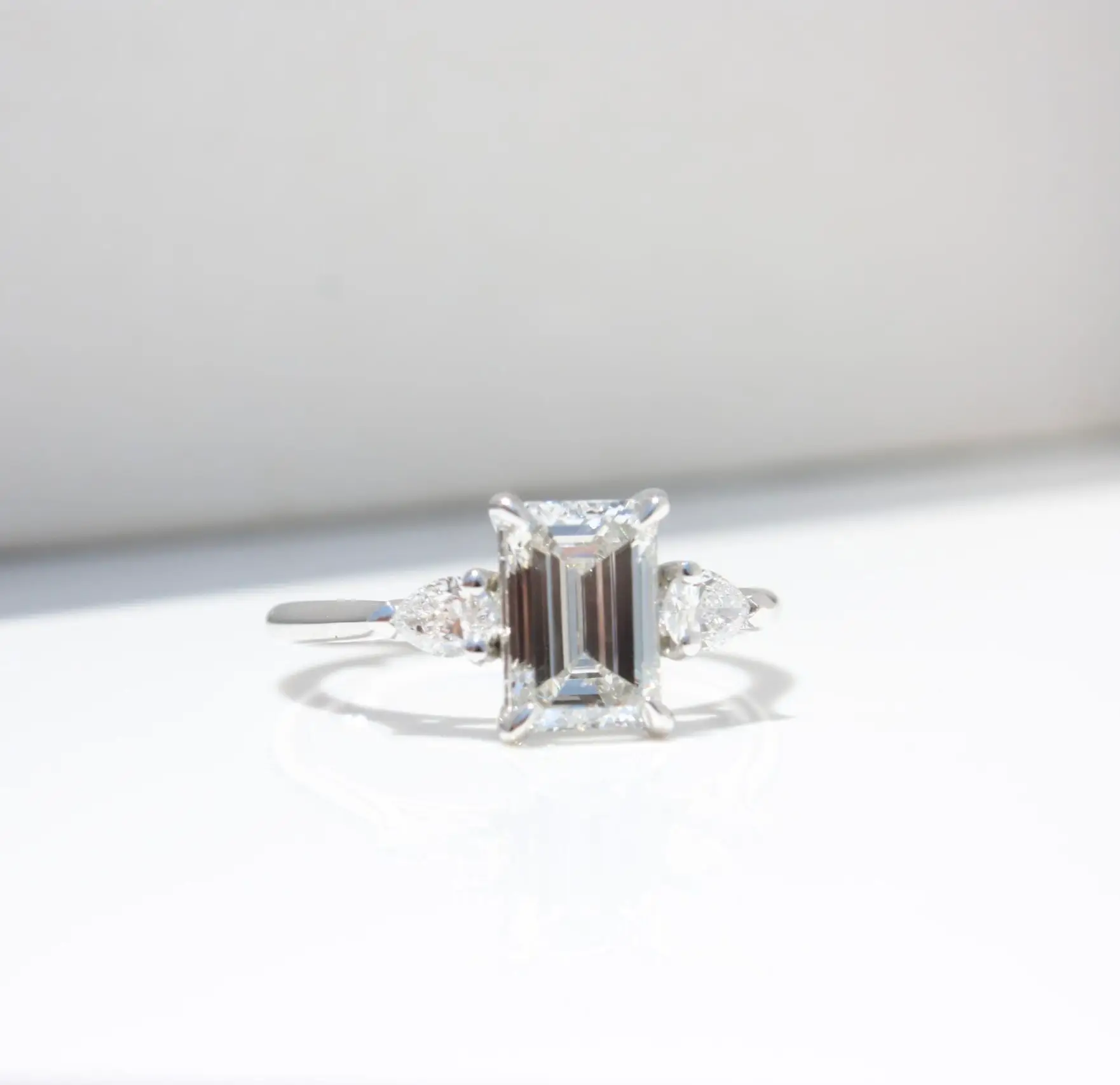 Emerald cut trilogy ring, diamond ring, engagement ring, emerald cut diamond, natural diamond, laboratory-grown diamond, trilogy ring, platinum ring, danielle camera jewellery
