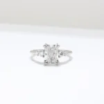 Duo Cluster Diamond Ring from Johannesburg, crafted in recycled gold or platinum. Radiant-cut centre stone with graduated round brilliant-cut diamonds in an open gallery setting, perfect for ethical and luxurious engagement rings.