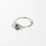 Affodil Cluster engagement ring in recycled gold or platinum with oval centre stone and marquise-cut diamond cluster inspired by daffodil flowers