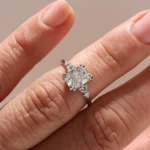 Duo Cluster Diamond Ring from Johannesburg, crafted in recycled gold or platinum. Radiant-cut centre stone with graduated round brilliant-cut diamonds in an open gallery setting, perfect for ethical and luxurious engagement rings.