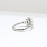Duo Cluster Diamond Ring from Johannesburg, crafted in recycled gold or platinum. Radiant-cut centre stone with graduated round brilliant-cut diamonds in an open gallery setting, perfect for ethical and luxurious engagement rings.