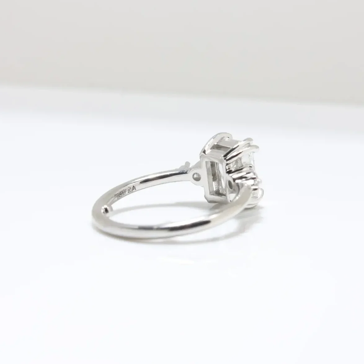 Duo Cluster Diamond Ring from Johannesburg, crafted in recycled gold or platinum. Radiant-cut centre stone with graduated round brilliant-cut diamonds in an open gallery setting, perfect for ethical and luxurious engagement rings.