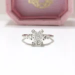Duo Cluster Diamond Ring from Johannesburg, crafted in recycled gold or platinum. Radiant-cut centre stone with graduated round brilliant-cut diamonds in an open gallery setting, perfect for ethical and luxurious engagement rings.