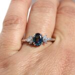 Affodil Cluster engagement ring in recycled gold or platinum with oval centre stone and marquise-cut diamond cluster inspired by daffodil flowers