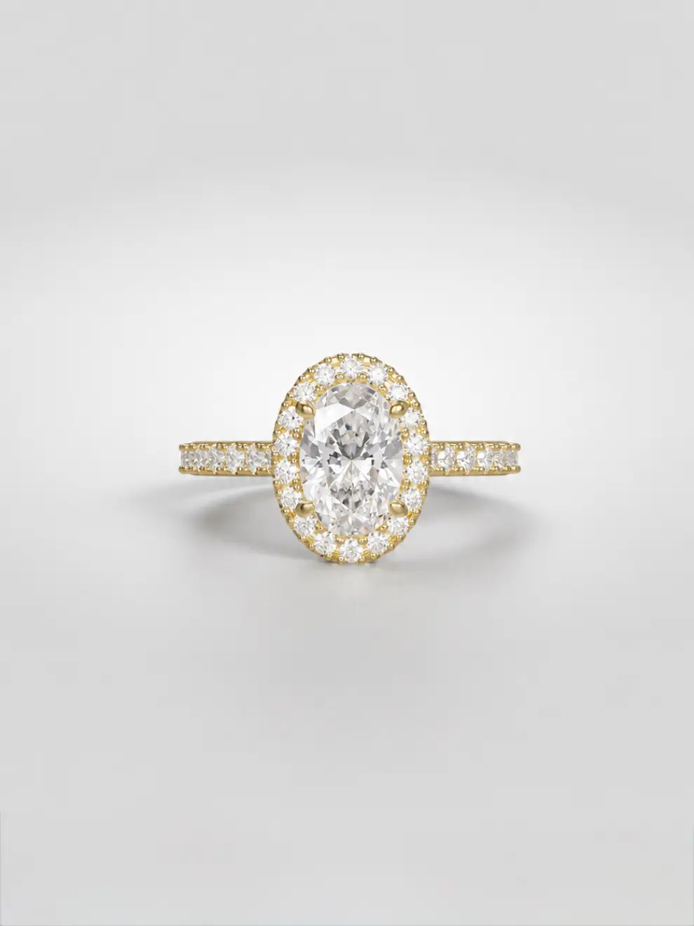 Oval diamond halo engagement ring with a sparkling pavé melee diamond band in gold.