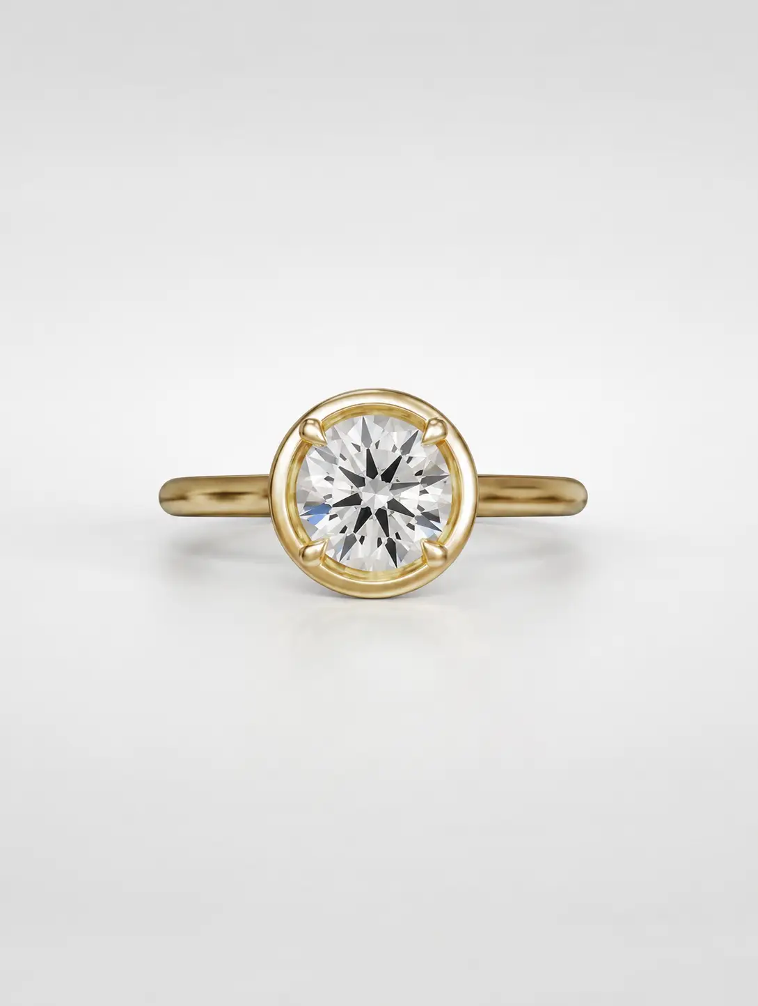 Round diamond solitaire ring with a tube accent and yellow gold cathedral setting.