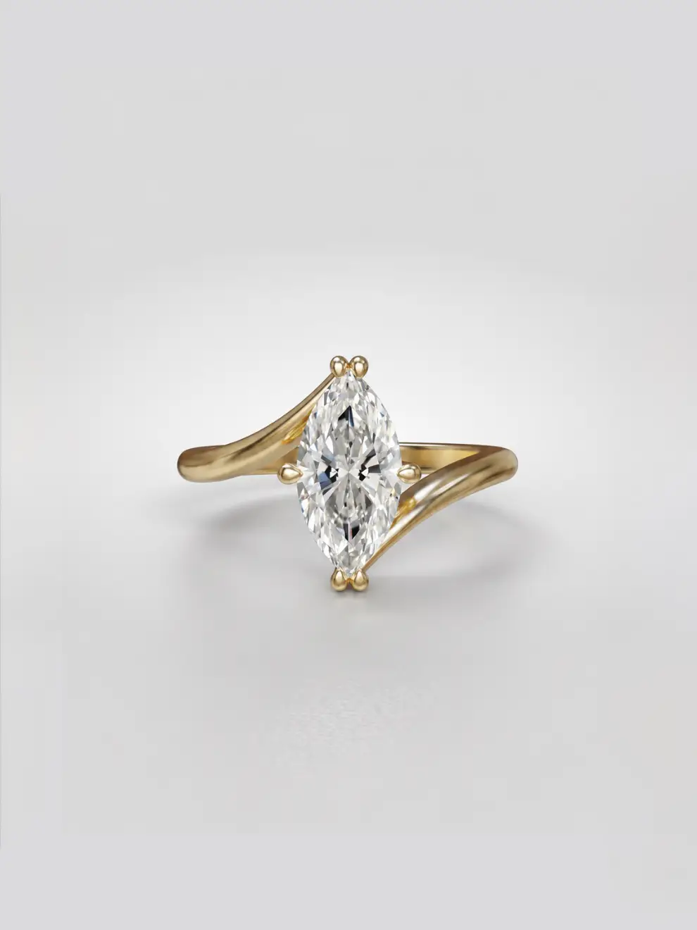 Marquise diamond bypass ring featuring a sculptural gold band that sweeps past the center stone.